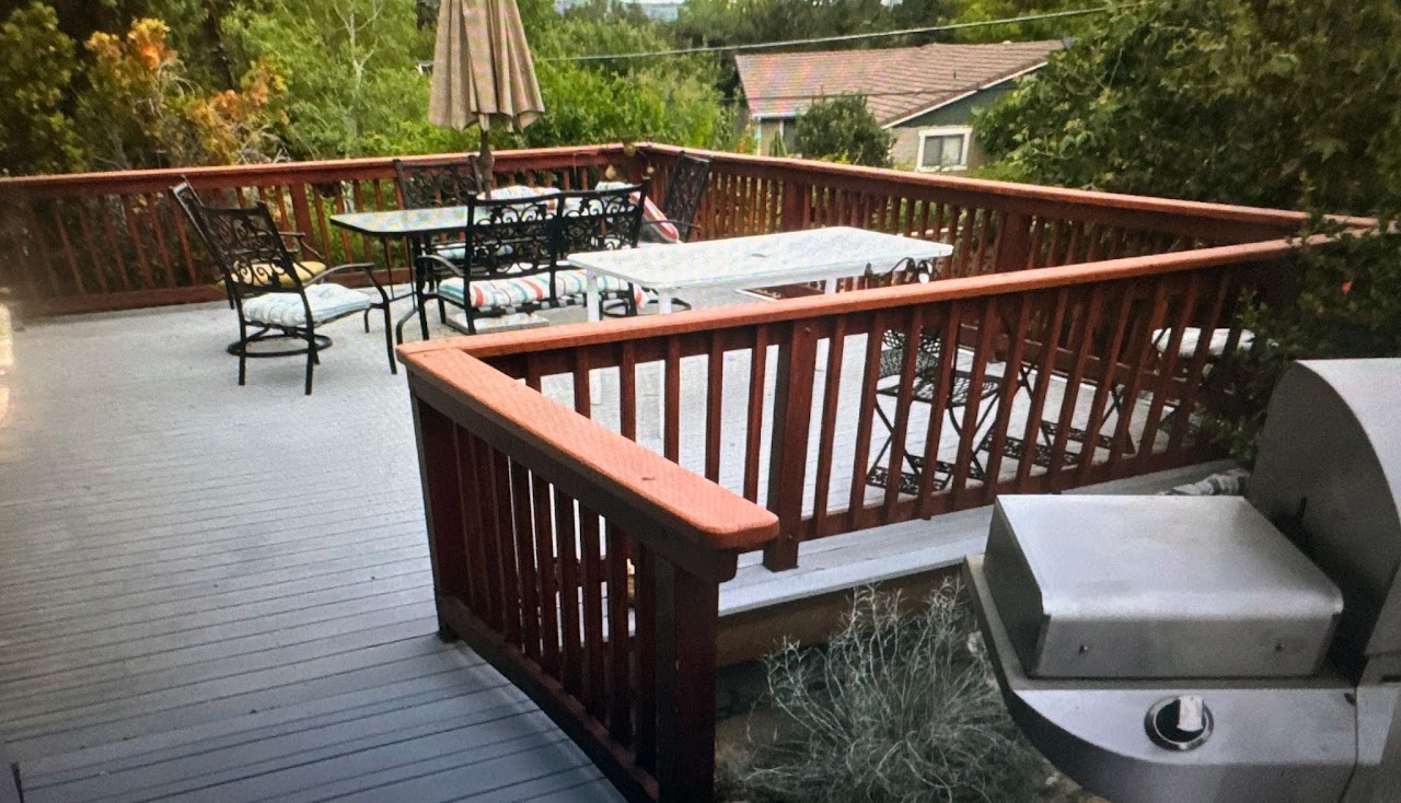Custom wood deck with railing and outdoor seating